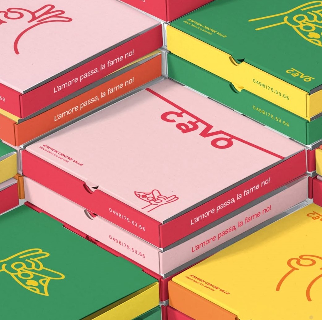 Colorful personalised pizza boxes stacked on top of each other showcasing unique designs.